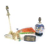 Two seascape collectors paperweights, a brass and glass table lamp, ceramic table lamp and a fish ca