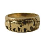 An Eastern inspired dress ring, with graduated design of three elephants, yellow metal, unmarked, be