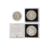Three American coins, comprising a John F Kennedy silver half dollar in presentation pack with certi