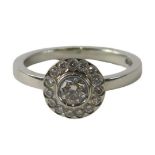 A David Fowkes of Lincoln platinum diamond dress ring, with round brilliant cut centre stone approx