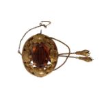 A Victorian citrine brooch, of circular raised design with central cabochon cut citrine in rub over