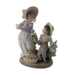 A Lladro figure group titled For You, 05453, 22cm high, boxed.