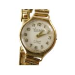 A 9ct gold Everite ladies wristwatch, with a silver coloured numeric dial, on three bar bracelet, 14