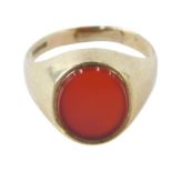 A 9ct gold signet ring, set with orange agate, on a plain band, ring size M½, 3.2g all in.