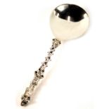 A Victorian Mappin & Webb silver apostle spoon, depicting religious figure reading, on twist serpent