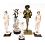 A resin gold and silvered art deco style figure of a lady wearing a hat, 41cm high, and four other f