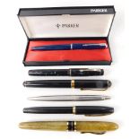A group of ballpoint and fountain pens, comprising Parker ballpoint, Sheaffer pen, Marksman, and oth
