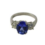A sapphire and diamond dress ring, the oval sapphire in double four claw setting, 9.4mm x 7.6mm x 5m