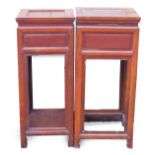 Two similar Chinese urn tables, each with a square top above a frieze drawer, on moulded supports, 8