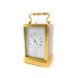 A late 19thC Japy Freres gilt brass repeating carriage clock, the white enamel dial stamped brevet d