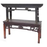 A Chinese ebonised opium or low table, the rectangular top above a pierced frieze, inset with carved