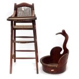 A Chinese red painted child's highchair, with caned back and basket woven seat, and a bucket with br