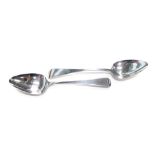 Two silver Fiddle pattern serving spoons, one Victorian, maker WW, Exeter 1830, and another 1834,