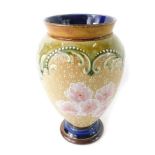 A Doulton Lambeth Slaters patent stoneware vase, with a brown rim, with pink flowers, numbered 8652,
