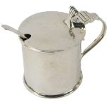 A George V silver mustard pot, with a scroll top handle on plain design with blue glass liner, and l