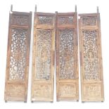 Four Chinese pierced and carved screen panels, each 138cm x 34cm. (AF)