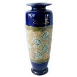 A Royal Doulton Lambeth stoneware urn, with a fluted circular top on a royal blue ground with gilt d