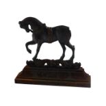 A Victorian black painted cast iron horse shaped door stop, 33cm wide. (AF)