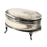 A George V silver jewellery casket, on four out splayed legs, Birmingham assay, 7cm wide.