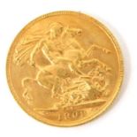 An Edward VII full gold sovereign dated 1909.