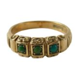 A 9ct gold turquoise dress ring, the rectangular panels set with three turquoise, with scroll sides,