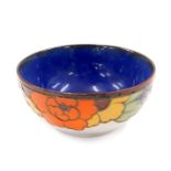 A Royal Doulton stoneware bowl, and decoration of flowers on light blue ground, 15cm diameter.