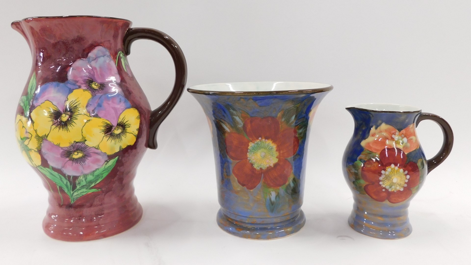 A group of Royal Doulton stoneware floral wares, comprising a pansy jug on a purple ground, 22cm hig - Image 2 of 4
