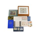 A group of collectors coins, to include Britain's first decimal coin set, two framed two dollar bank
