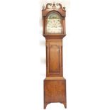 A 19thC longcase clock by W Chapman of Lincoln, the arched painted dial decorated with rural scenes