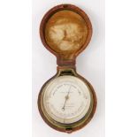 A Callaghan of London travel barometer, in a brass case with silvered dial, 6.5cm diameter, in fitte