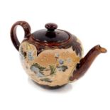 A Doulton Lambeth stoneware teapot, with brown treacle glaze, and a design of flowers and leaves, 14