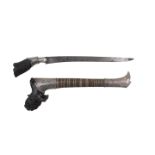 A Malay Sawar white metal mounted dagger, with carved horn handle and hand guard and single edged bl