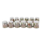 A full set of Hutschenreuther of Germany floral month thimbles. (12)
