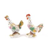 Two continental porcelain cockerels, each hand painted with gilt highlights unmarked, 12cm high. (AF