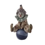 A Lladro Having A Ball clown figure, number 5813, 16cm high, boxed.