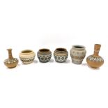 Six pieces of Doulton Lambeth Silicon wares, comprising two stem vases and four small vases, the lar