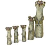 A collection of painted resin meerkats, stamped to reverse, copyright model design, the largest 29cm