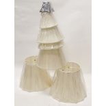 A quantity of cream fabric light shades of various sizes and designs, and a black shade. (AF)