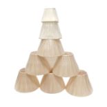 Various cream coloured lamp shades.