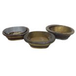 Three Chinese coopered oval wash bowls, the largest 53cm wide. (AF)