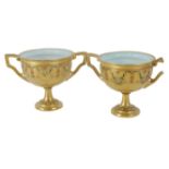 A pair of miniature Royal Worcester porcelain vases, each gilt decorated with a floral banding in bl