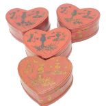 A set of four Chinese red and gilt lacquer heart shaped boxes and covers, each decorated with flower