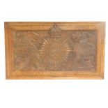 A late 19thC/early 20thC carved oak plaque or panel, decorated with the crest of Lincolnshire Consta