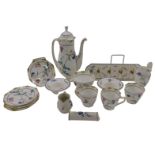 A Royal Doulton small coffee service, printed and painted with design of flowers, with octagonal cup