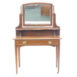 An Edwardian mahogany and satinwood cross banded and boxwood strung dressing table, the raised back