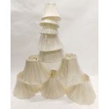 Various cream fabric coloured lamp shades of various sizes. (AF)