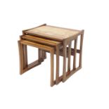 A nest of three G-Plan teak occasional tables, each with a rectangular top, applied