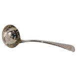 A Victorian silver ladle, with a pierced bowl, on fiddle pattern and engine engraved stem bearing th