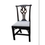 A George III elm side chair, with a pierced splat and a drop in seat, on plain legs with pierced bra