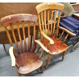 Two stained pine lath back kitchen chairs.